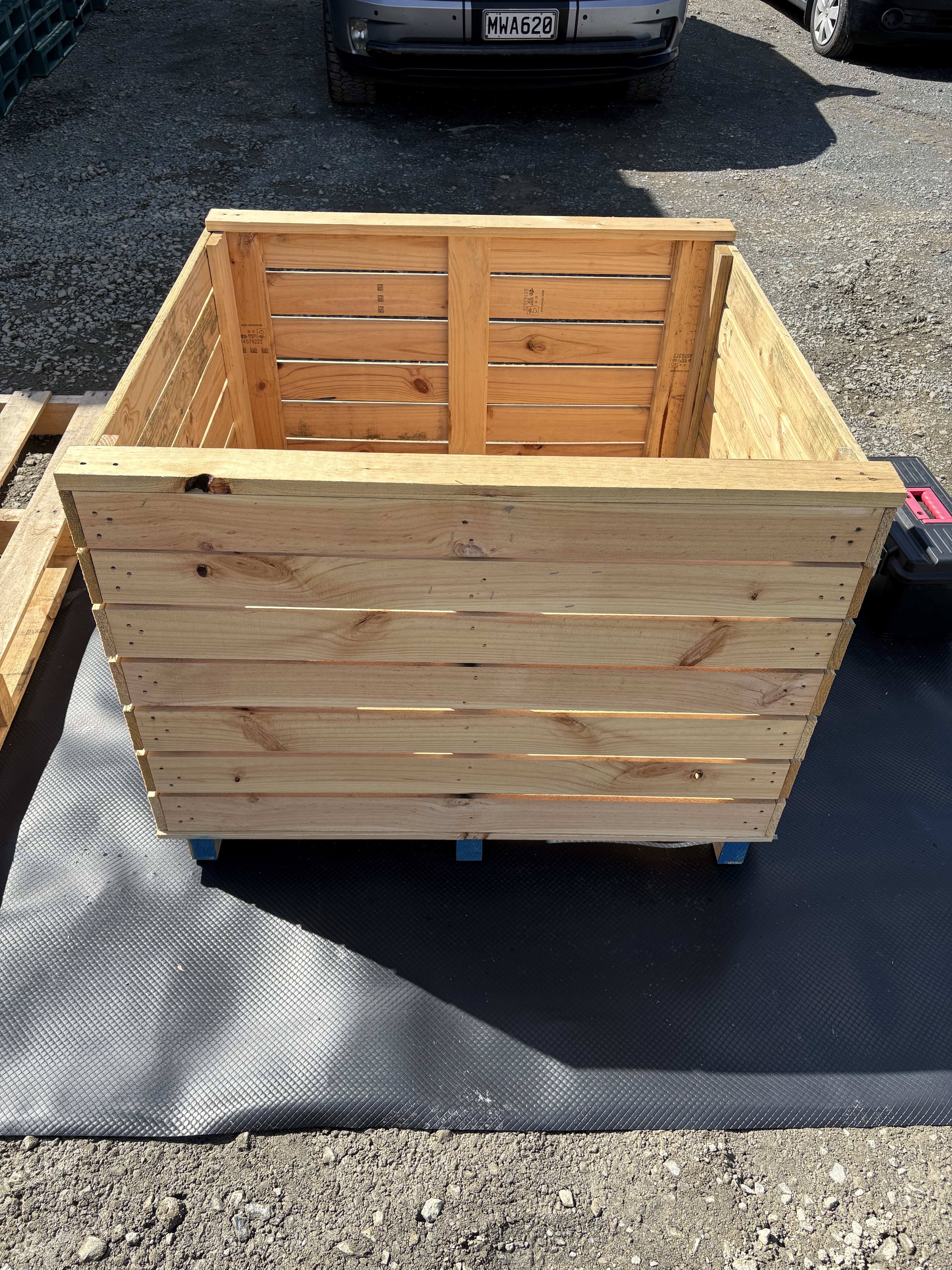 a photo of a wooden fruit bin